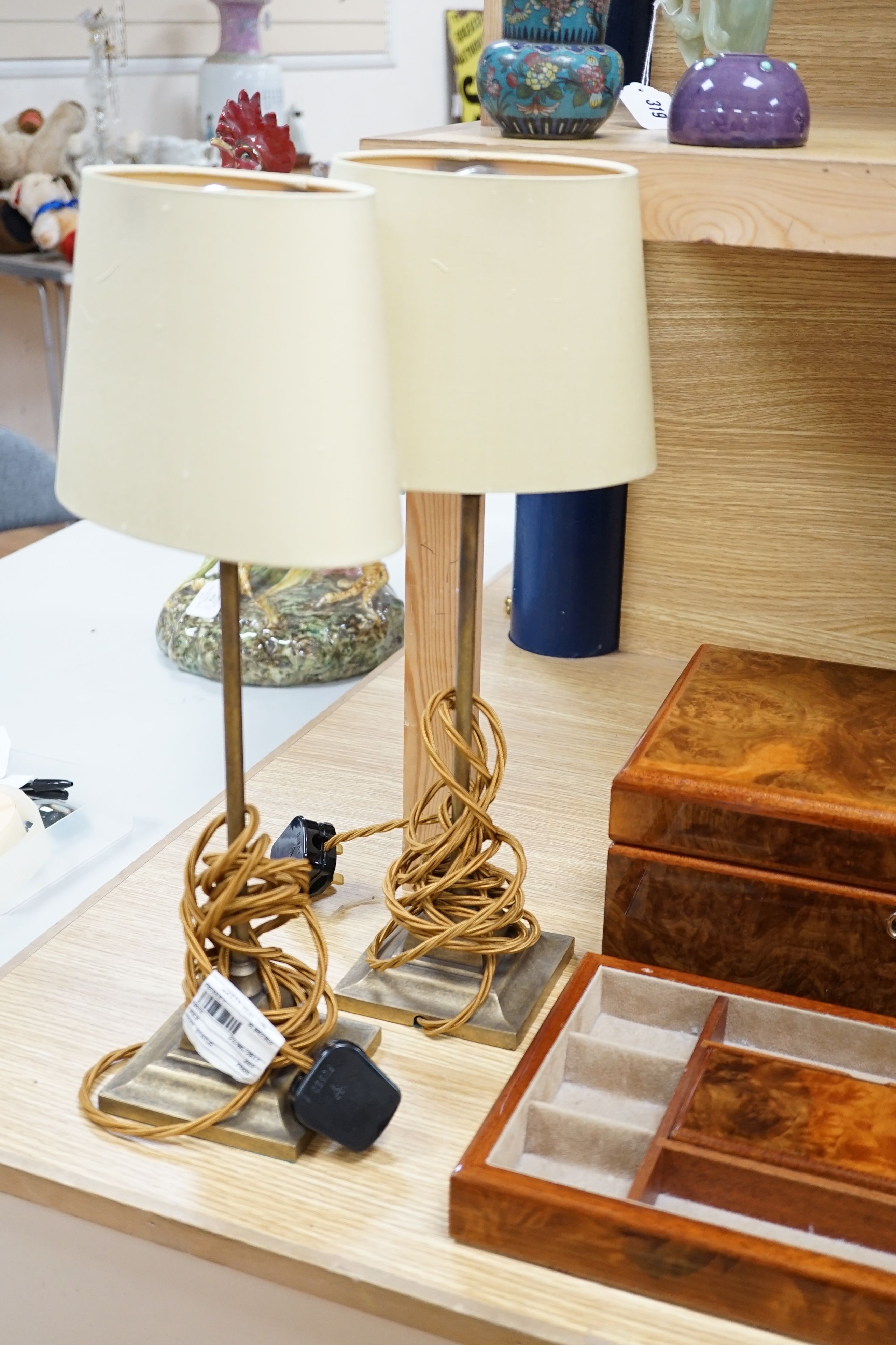 A burr walnut jewellery box, collection of gilt photo frames and a pair of table lamps